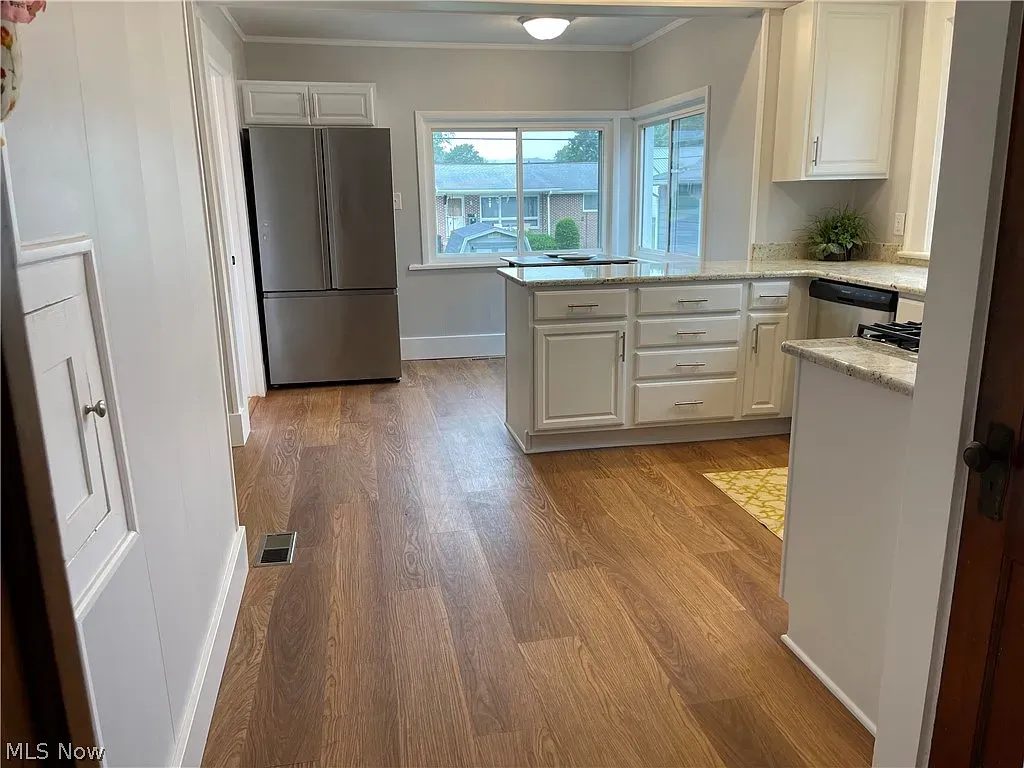 Finished kitchen remodel viewed from hallway