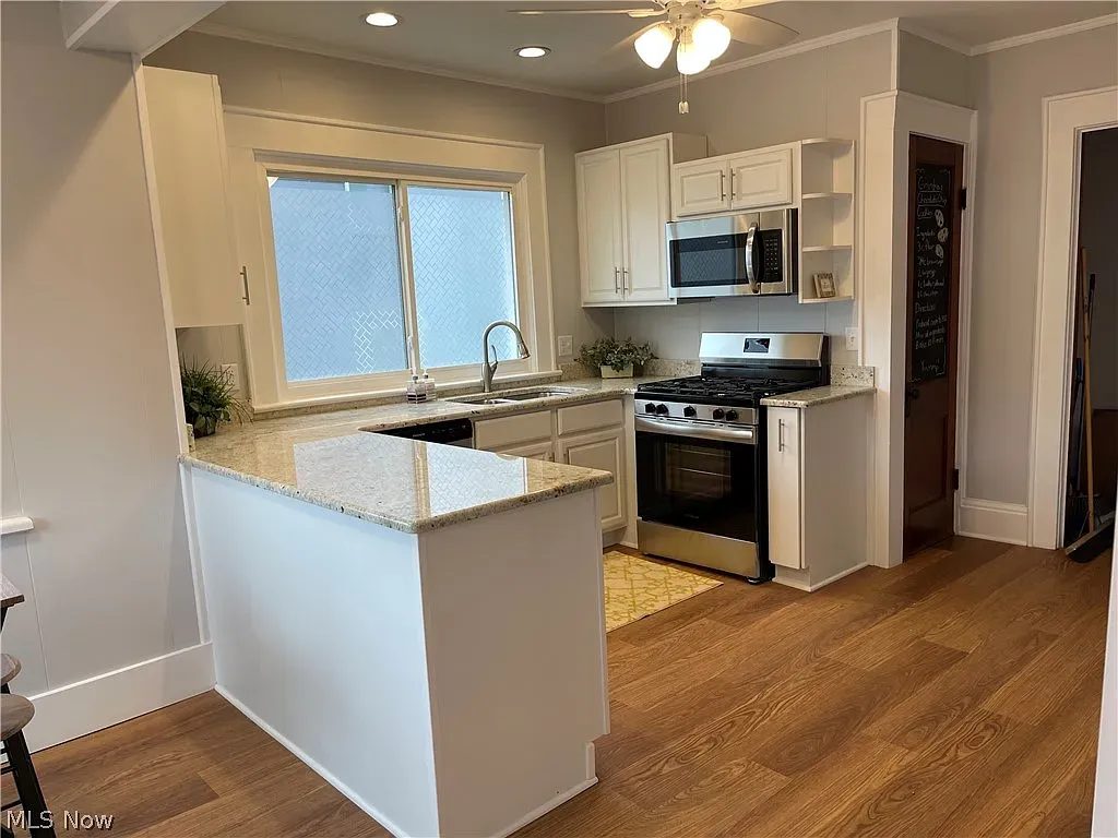 Finished white kitchen remodel with granite counters